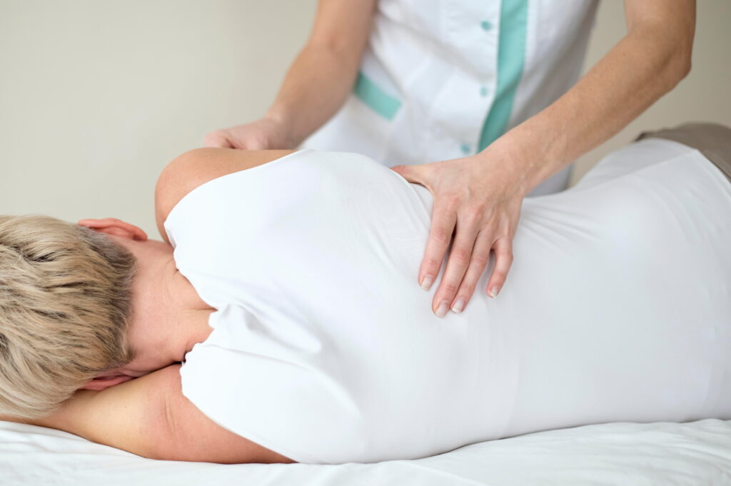 a woman doing osteopathic manual therapy